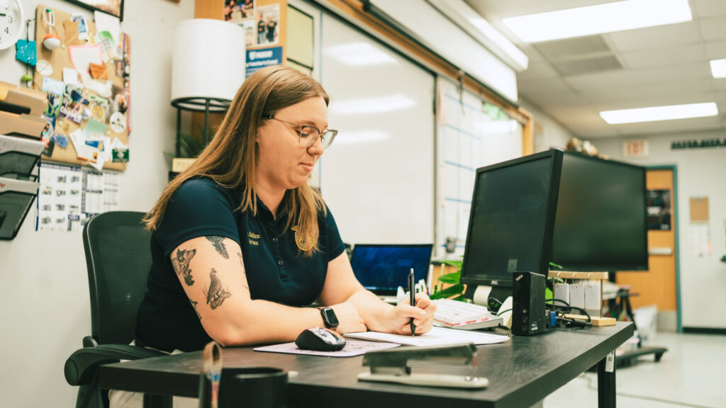 Student working at computer in classroom