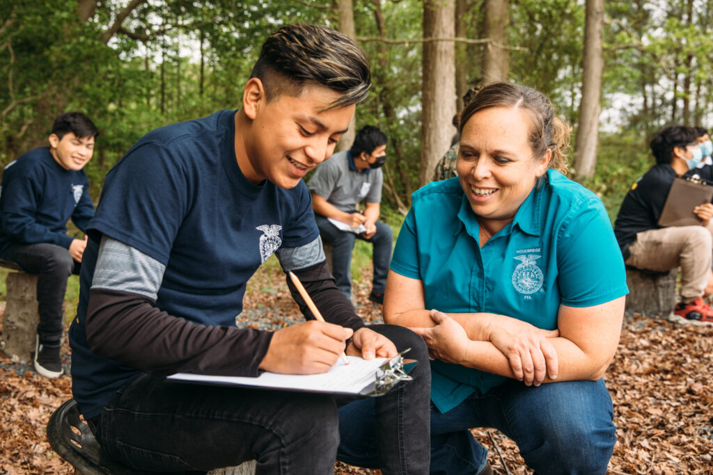 FFA Advisor Mentoring Student in Outdoor Setting